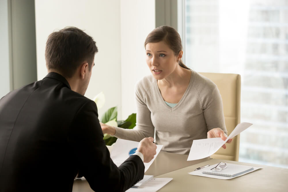 Female client arguing with her personal injury lawyer.